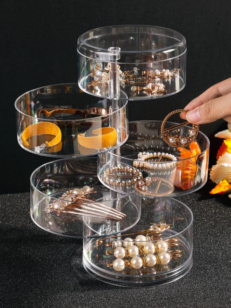 Transparenter Acryl-Schmuck-Organizer mit drehbaren Fächern, ideal zur Aufbewahrung von Ohrringen.