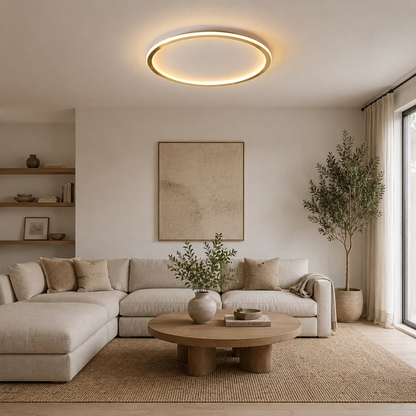 Dimmbare Ringleuchte über einer Sofaecke mit rundem Holztisch in einem hellen Wohnraum 6