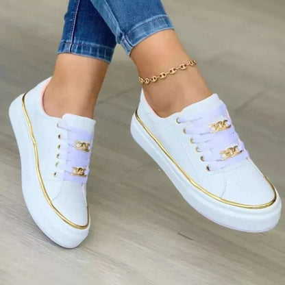 Weiße Damen-Sneaker mit goldenen Details, lässig, modisch, bequem, ideal für Alltag.