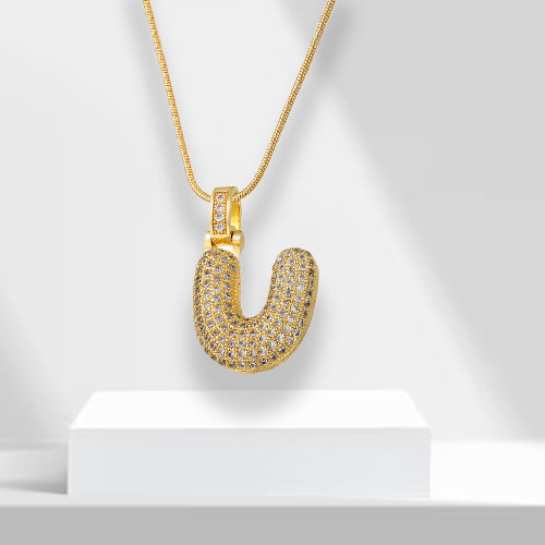 Goldene U-förmige Halskette mit Strasssteinen, elegantes Schmuckstück, luxuriöses Design.