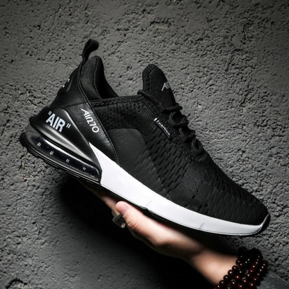 Schwarze Unisex-Sneaker, atmungsaktiv, mit weißer Sohle, ideal für Sport und Freizeit.