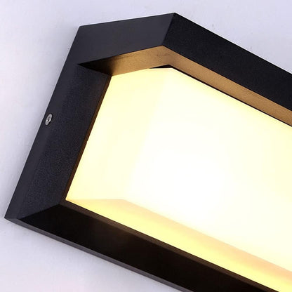 Nahaufnahme der Gehäuseecke mit schwarzem Rahmen, sichtbarer Schraube und milchigem, warm leuchtendem Diffusor 2