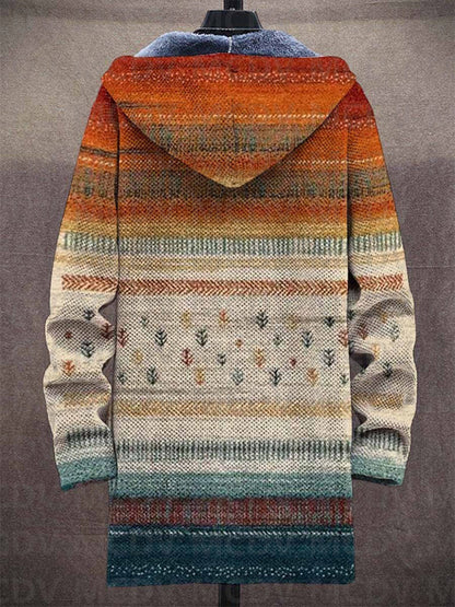 Rückansicht der langen Kapuzenjacke mit horizontalen Streifen, kleinen Baummotiven und Farbverlauf von Orange zu Blaugrün 2