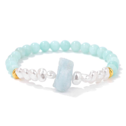 Armband aus Aquamarin, Perlen und Gold, handgefertigt, elegantes Schmuckdesign, Damenaccessoire.