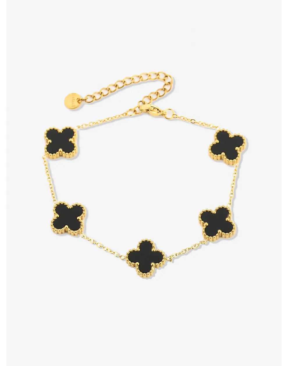 Goldenes Armband mit schwarzen Kleeblatt-Anhängern, elegantes Schmuckdesign, Damenaccessoire.