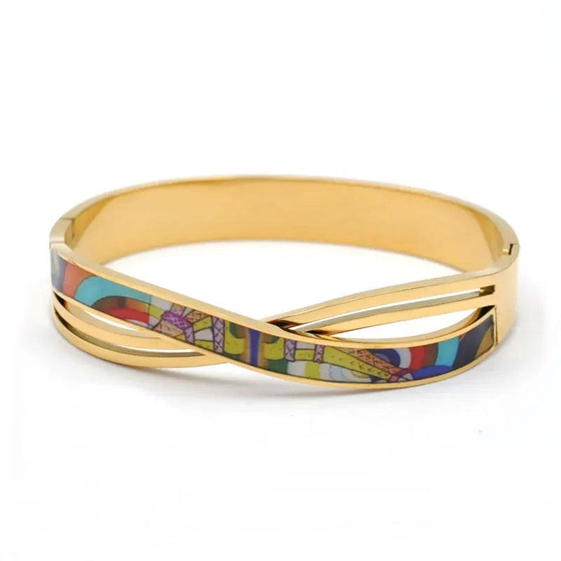 Goldenes Armband mit buntem Emaille-Design, eleganter Schmuck, modisches Accessoire.