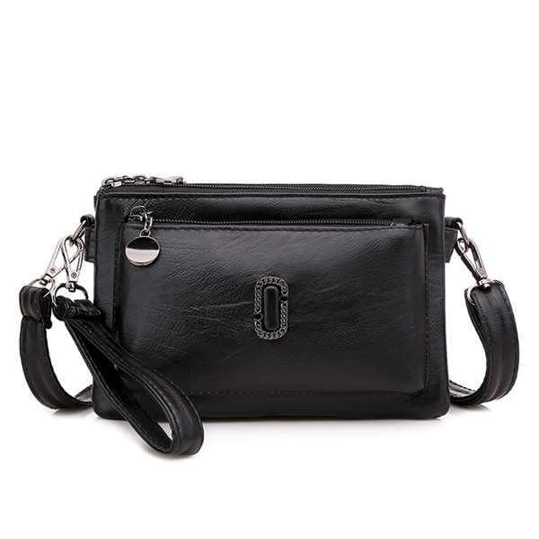 Schwarze Lederhandtasche mit Reißverschluss, abnehmbarer Schulterriemen, elegantes Design.