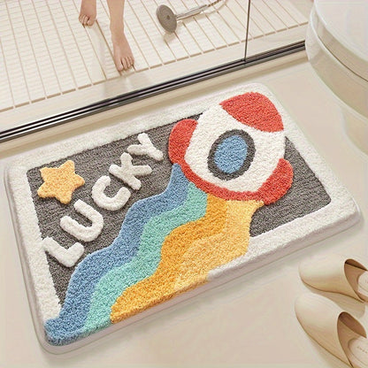 Bunte Badematte mit Raketenmotiv und "Lucky"-Schriftzug im Badezimmer, rutschfest, saugfähig.