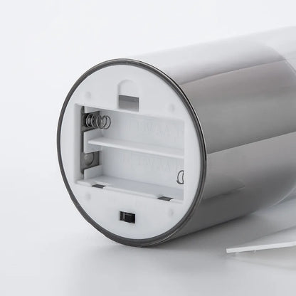 Silberner batteriebetriebener Seifenspender, zylindrisch, Kunststoff, modernes Design.