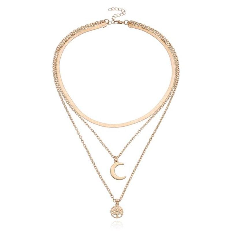 Goldene Halskette mit Halbmond und Lebensbaum-Anhänger, Boho-Stil, handgefertigt.