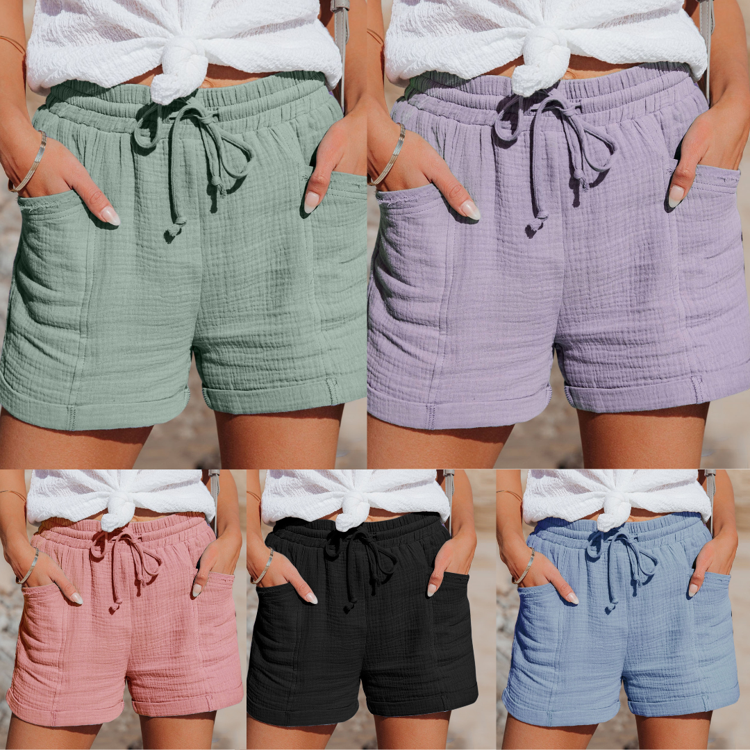 Fünf Damen-Shorts aus Baumwolle in Grün, Lila, Rosa, Schwarz und Blau mit Kordelzug und Taschen.