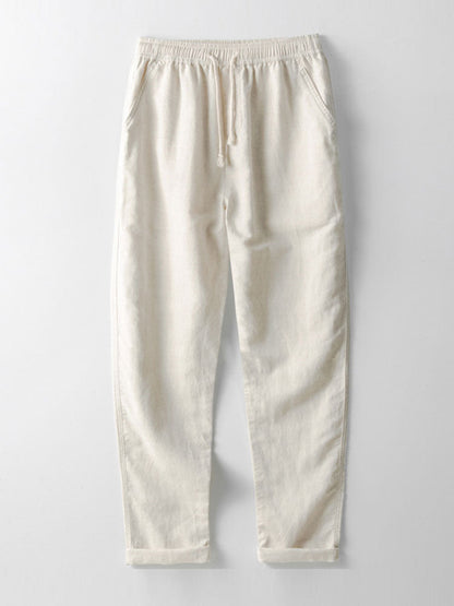 Beige Jogginghose aus Baumwolle mit elastischem Bund und Kordelzug, lässiger Stil.