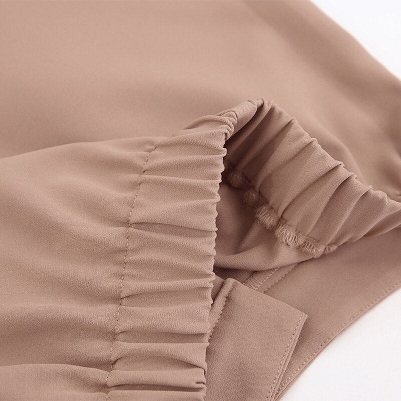 Beige Damenrock aus Polyester mit elastischem Bund, elegant, knitterfrei, modisch.