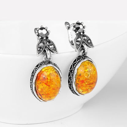Silberne Ohrringe mit Bernstein, Vintage-Stil, Damen-Schmuck, elegantes Design.