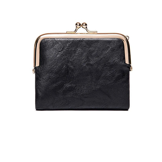Schwarze Leder-Geldbörse mit Metallverschluss, elegantes Design, Damen-Accessoire.
