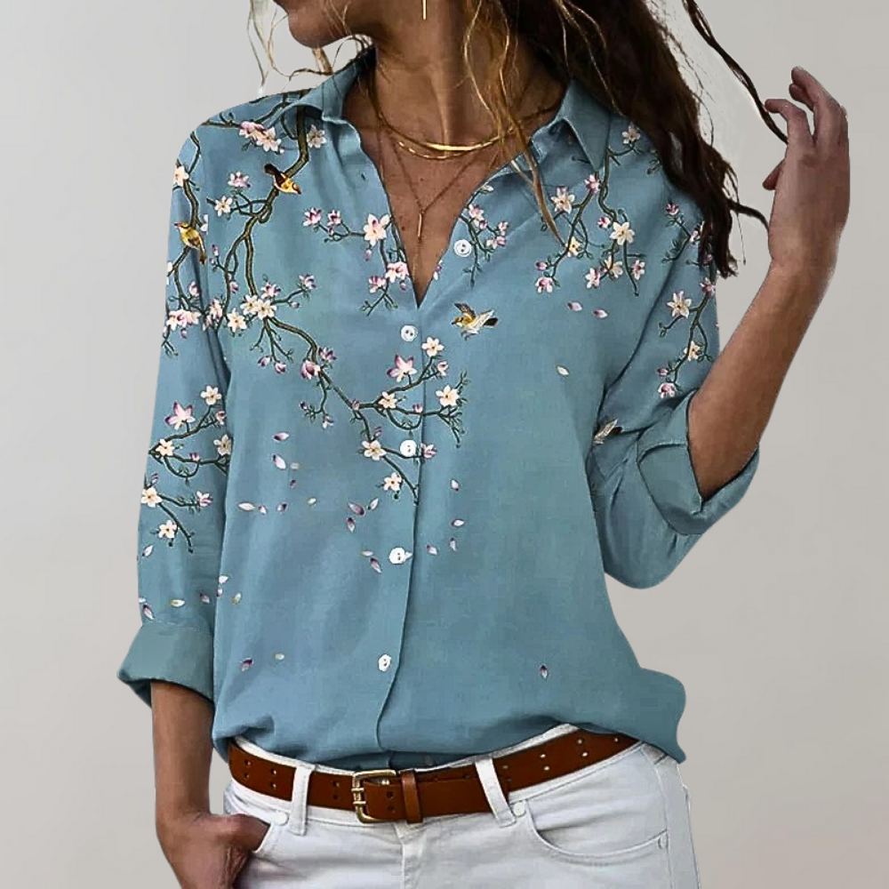 Damenbluse blau mit Blumenmuster, Langarm, Baumwolle, Freizeitmode, elegant, Frühlingstrend.