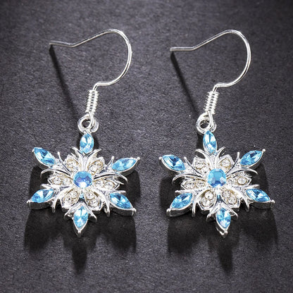 Silberne Ohrringe mit blauen Kristallen, Blumenform, eleganter Schmuck, Damenaccessoire.