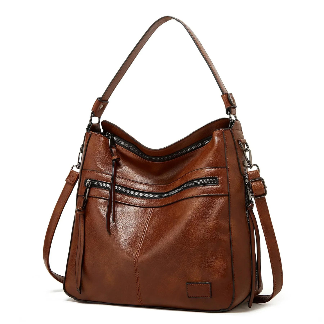 Braune Lederhandtasche mit Reißverschlusstaschen, verstellbarem Schulterriemen, modisch und elegant.