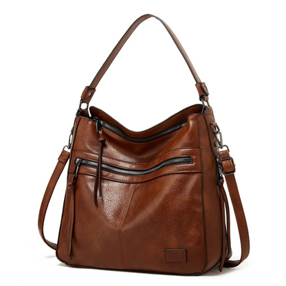 Braune Lederhandtasche mit Reißverschlusstaschen, verstellbarem Schulterriemen, modisch und elegant.