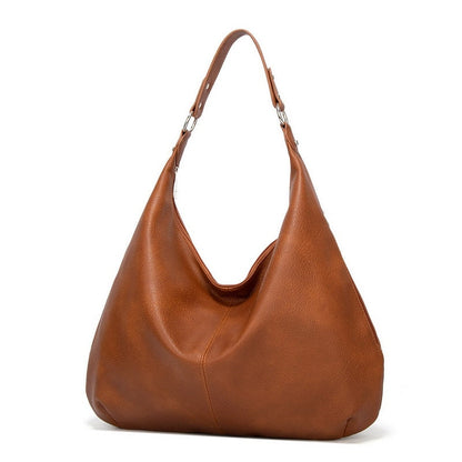 Braune Lederhandtasche, Hobo-Stil, Damenmode, elegantes Design, Schultertasche, Accessoire.