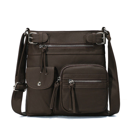 Braune, multifunktionale Anti-Diebstahl-Tasche aus Leder mit mehreren Reißverschlusstaschen.