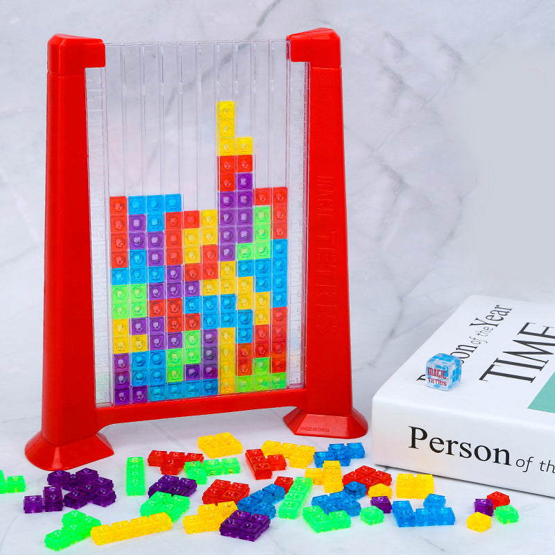 Rotes Tetris-Spielzeug aus Kunststoff mit bunten Bausteinen auf Marmortisch.