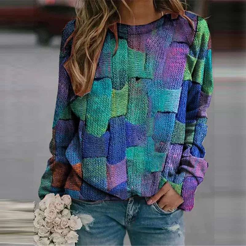 Frau in buntem Strickpullover mit Blumenstrauß, lässige Mode, Herbstkleidung, Jeans.