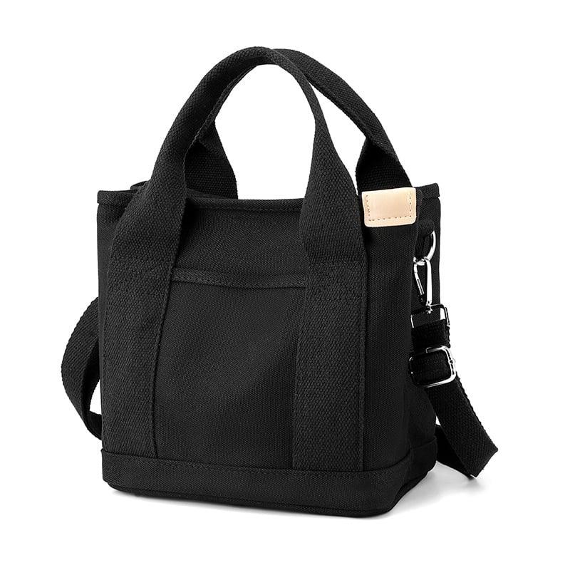 Schwarze Canvas-Umhängetasche für Damen, klein, mit verstellbarem Riemen und Tragegriffen.