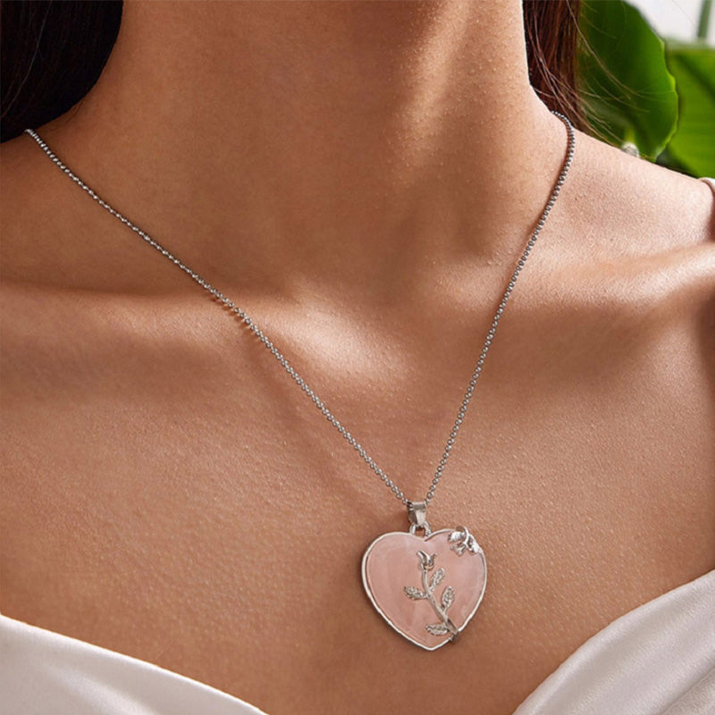 Herzanhänger Halskette Silber mit rosa Stein und Blattdesign, eleganter Schmuck für Damen.