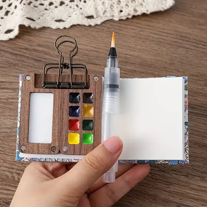 Mini-Aquarell-Set mit Pinselstift, Holzpalette, 8 Farben, ideal für unterwegs, kompakt.