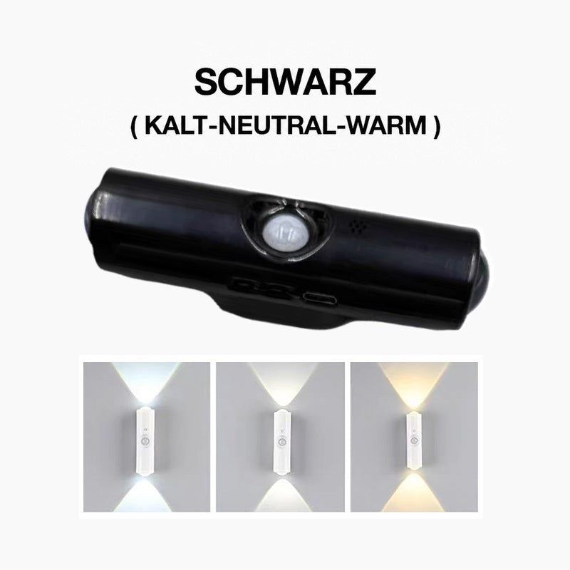 Schwarze Wandleuchte mit Bewegungssensor in der Mitte, darunter drei weiße Lichtfarben an der Wand 3