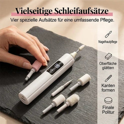 Hand greift auf dunkler Schieferplatte nach einem rosa Aufsatz, die übrigen Aufsätze liegen neben dem Gerät 3