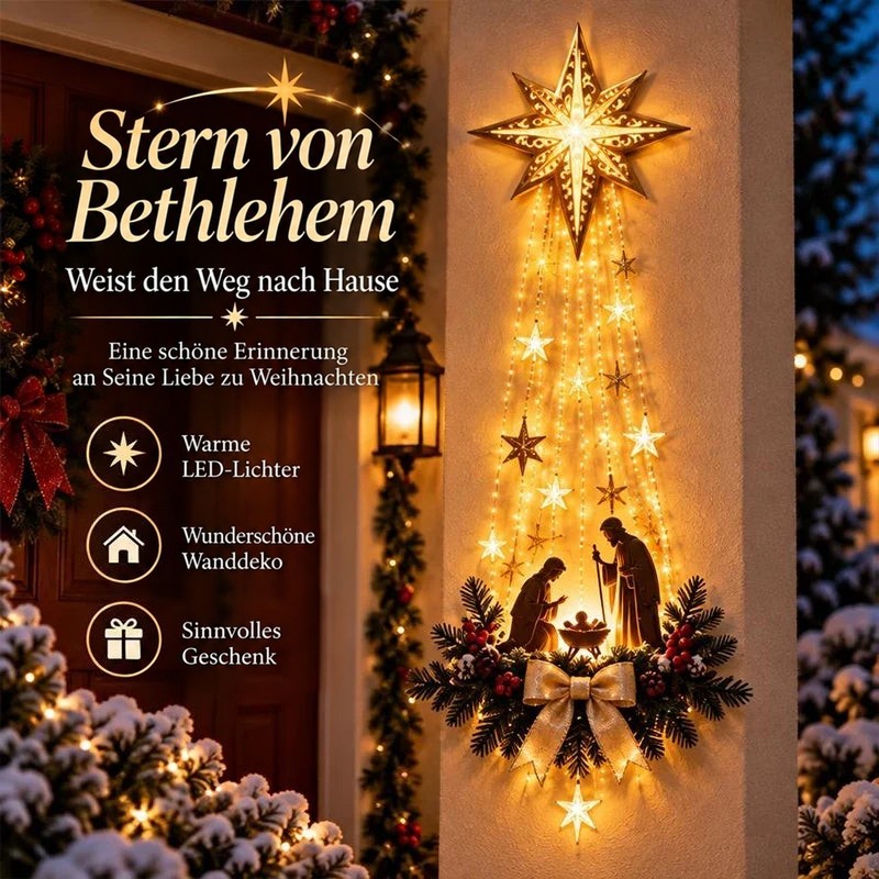 Leuchtender Stern mit herabhängenden Lichterketten und Krippenszene an einer Hauswand neben der Tür bei Schnee 1
