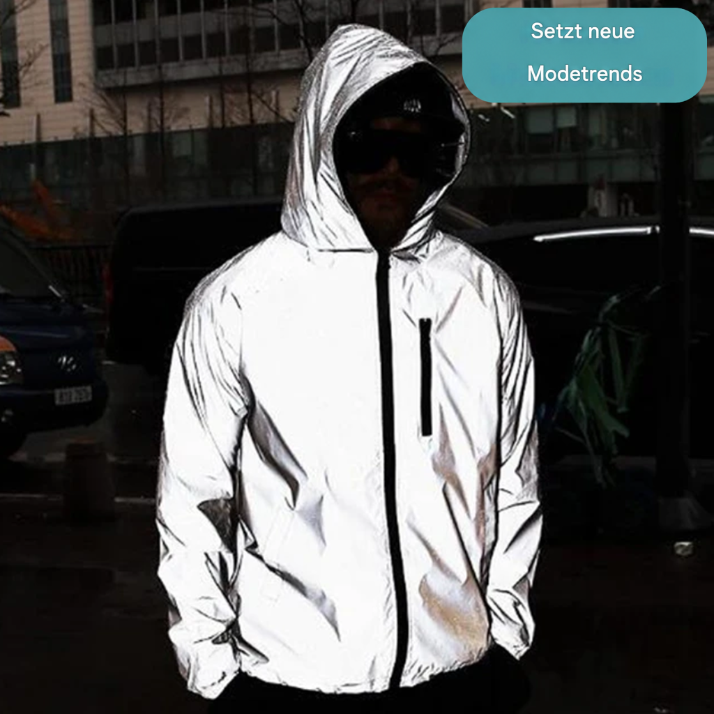 Mann mit Kapuze und Sonnenbrille trägt die Jacke, Hände in den Taschen, vor nächtlicher Straßenkulisse 7