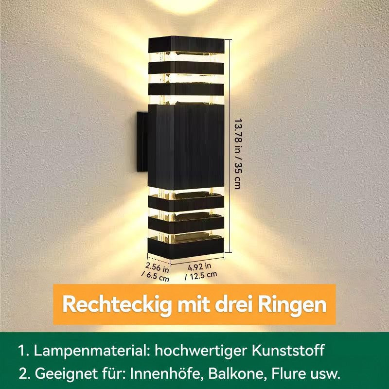 Eckige Wandleuchte mit drei Ringen oben und unten, mit eingeblendeten Maßen zu Höhe, Breite und Tiefe 18