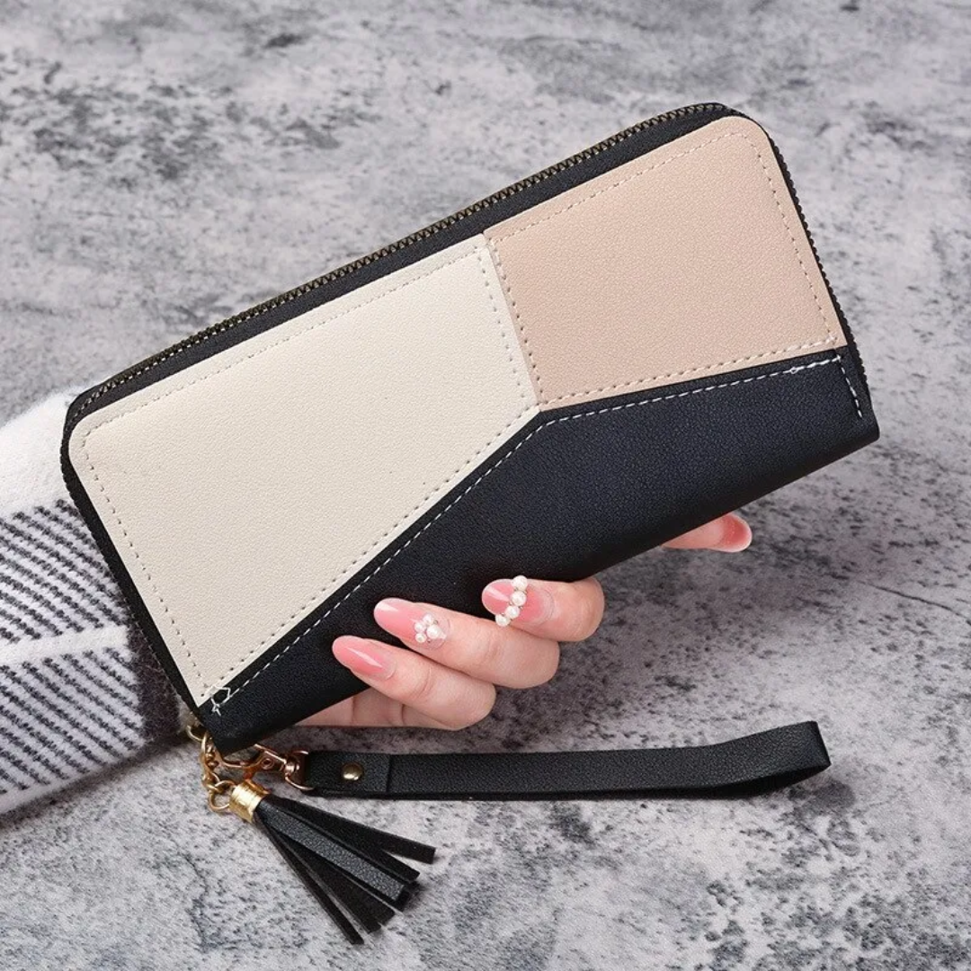 Damen-Geldbörse aus Leder, schwarz-beige, mit Reißverschluss und Quaste, elegant und modern.