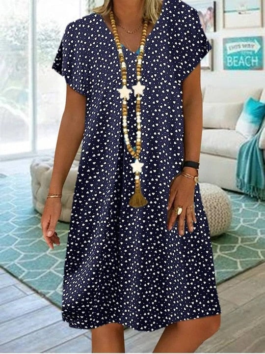 Damen Sommerkleid blau mit weißen Punkten, V-Ausschnitt, lässig, kurzärmelig, Strandmode.