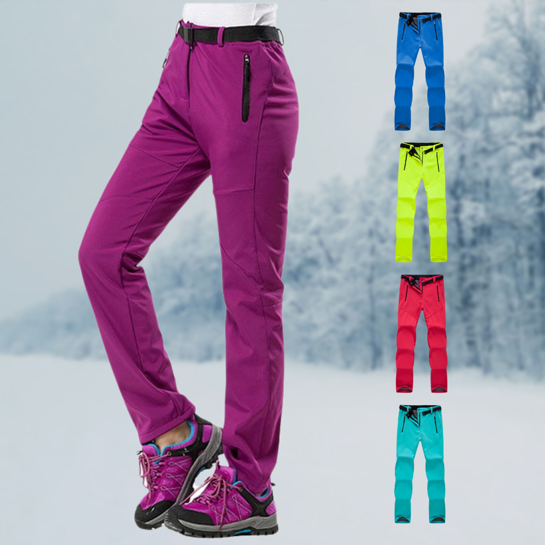 Damen Wanderhose lila, wasserabweisend, mit Reißverschlusstaschen, ideal für Outdoor-Aktivitäten.