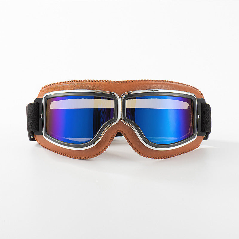Fliegerbrille mit hellbrauner Lederpolsterung und Chromrahmen, die Gläser schimmern blau verspiegelt. 9
