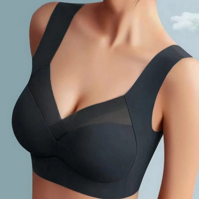 Nahtloser BH in Schwarz mit breiten Trägern und transparentem Mesh-Einsatz im V-Ausschnitt, an einem Model getragen. 3