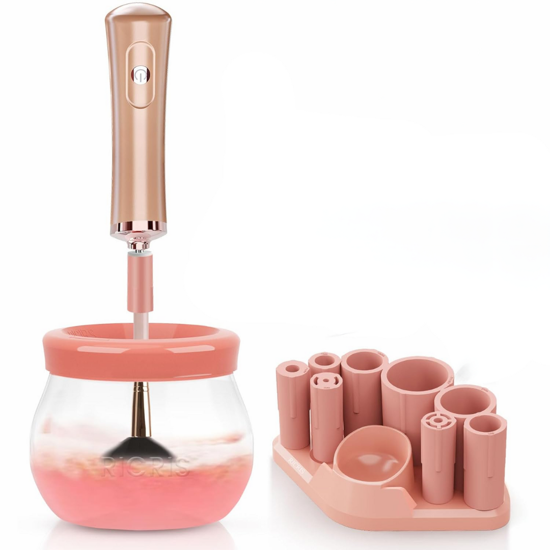Elektrischer Make-up-Pinselreiniger, rosa, mit Halterung und Reinigungsbehälter.