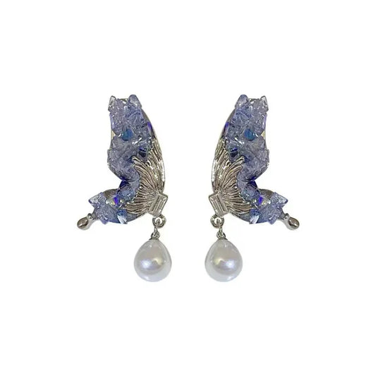 Silberne Ohrringe mit blauen Kristallen und Perlenanhänger, eleganter Schmuck für Damen.