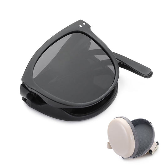 Schwarze faltbare Sonnenbrille mit Etui, UV-Schutz, modisch, kompakt, Reiseaccessoire.