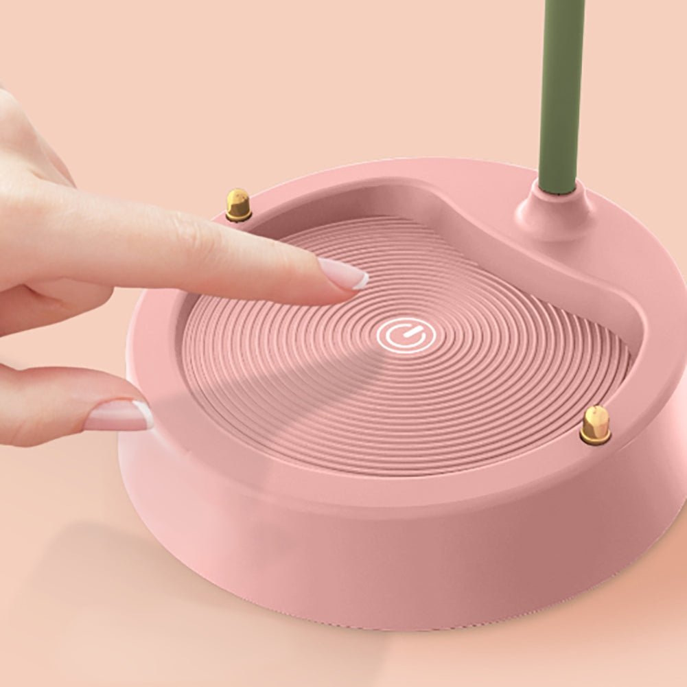 Rosa kabelloser Ladegerät-Ständer, rund, mit Fingerberührung, modernes Design.