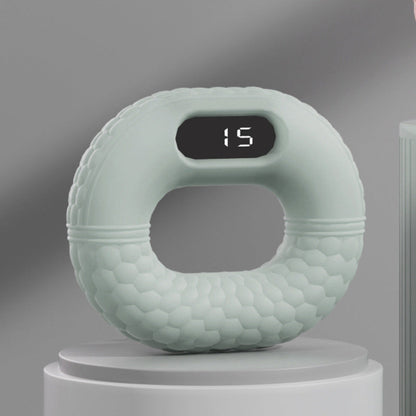 Grüner digitaler Fitnessring mit Display, ergonomisches Design, Heimtraining, Sportgerät.