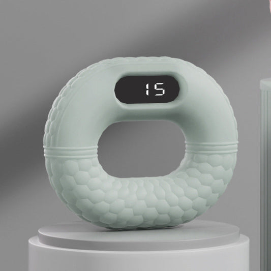 Grüner digitaler Fitnessring mit Display, ergonomisches Design, Heimtraining, Sportgerät.