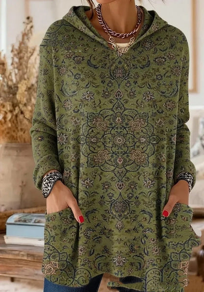 Getragene Tunika in Olivgrün mit feinem Blumen- und Ornamentmuster in Dunkelblau und Rosé, Kapuze und Taschen. 7