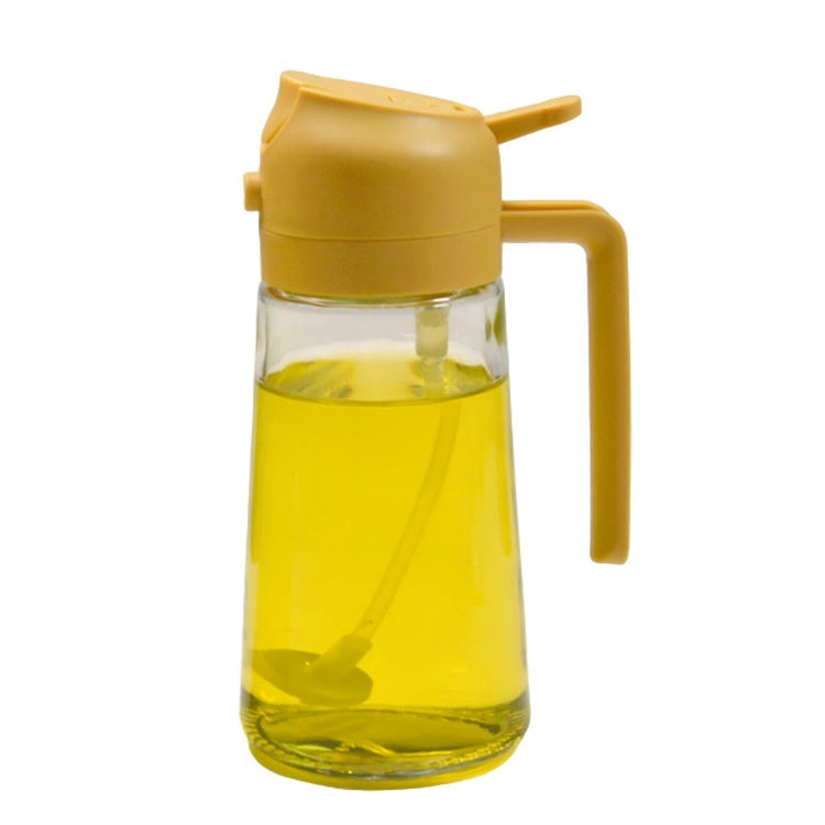 Gelber Ölspender aus Glas mit Kunststoffdeckel und Griff, ideal für Küche und Esszimmer.