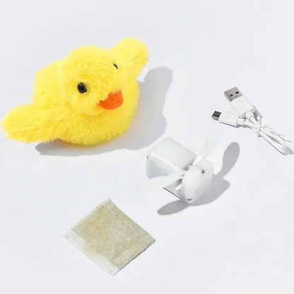 Gelbes Plüsch-Entenküken mit USB-Ventilator und Ladekabel auf weißem Hintergrund.