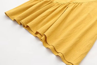 Gelber Baumwollrock mit Rüschen, Damenmode, Sommerkleidung, knielang, elegant, modisch.